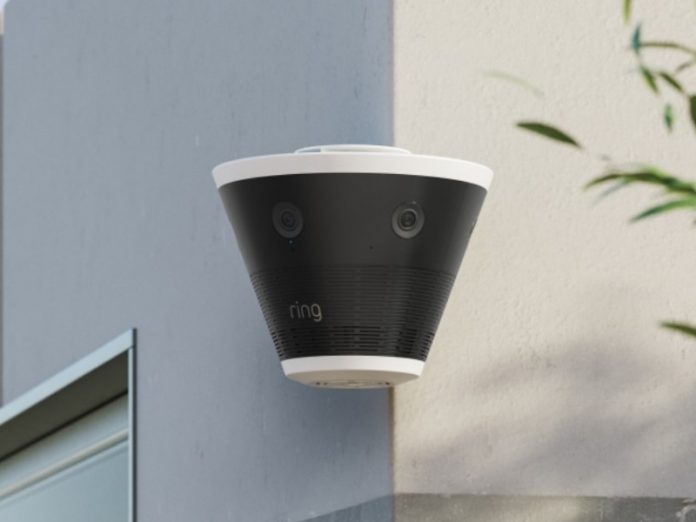 Ring Elite CES 2026, een zwarte conische beveiligingscamera met witte rand gemonteerd op een buitenhoek, met een 270° zicht door vijf 4K-streams.