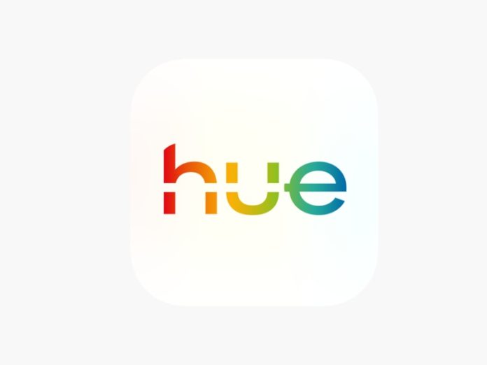 App-icoon van de Philips Hue AI Assistent Nederlands: de letters 'hue' in een gesegmenteerd veelkleurig lettertype (rood, oranje, groen en blauw) op een witte achtergrond.