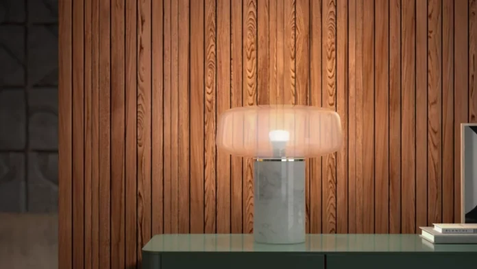 Een moderne tafellamp met een marmeren voet en een HUE lichtbron verspreidt een sfeervol licht voor een stijlvolle wand van houten panelen.