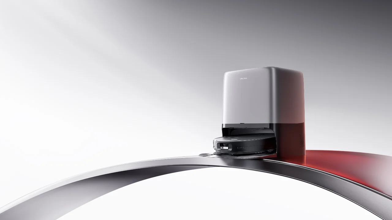 Roborock robot vacuum and docking station on a sleek curved platform with futuristic studio lighting.
